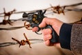 Hand Holding a Charged Revolver Royalty Free Stock Photo