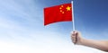 Hand holding Chinese flag. china flag in hand Royalty Free Stock Photo