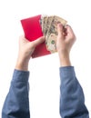 Hand holding chinese red envelope with money isolated over white background. Royalty Free Stock Photo