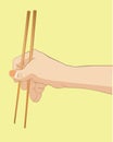 Hand holding chopstick