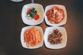 Hand holding chopsticks for eating Kimchi salad in restaurant. Korean food traditional Kimchi.Korean food traditional cuisine