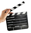 A hand holding a clapper board Royalty Free Stock Photo