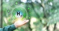 Hand holding clean hydrogen energy world with eco environment icon, Save world, technology sustainable alternative environment Royalty Free Stock Photo