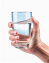 Hand holding a clear glass of water