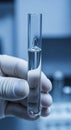 Hand holding clear laboratory test tube Royalty Free Stock Photo