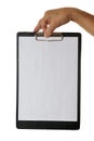 Hand holding clipboard with blank sheet of paper isolated on white background Royalty Free Stock Photo