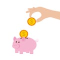 Hand holding coin to insert to pink piggy bank isolated on background. Royalty Free Stock Photo