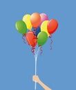 Hand holding colorful balloons Royalty Free Stock Photo