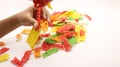 Hand holding colorful crackers or krupuk unfired isolated Royalty Free Stock Photo