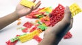 Hand holding colorful crackers or krupuk unfired isolated Royalty Free Stock Photo