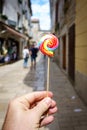 Hand holding colorful lolipop