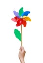Hand holding Colorful pinwheel over white background Royalty Free Stock Photo