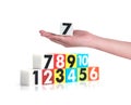 Hand holding colorful plastic numbers on white background ,No1 Royalty Free Stock Photo