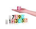 Hand holding colorful plastic numbers on white background ,No1 Royalty Free Stock Photo
