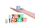 Hand holding colorful plastic numbers on white background ,No1 Royalty Free Stock Photo