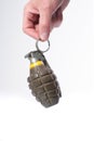 Hand holding a combat pineapple grenade Royalty Free Stock Photo