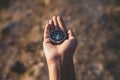 Hand holding compass looking for direction. Searching and exploring concept Royalty Free Stock Photo