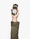 Hand holding a compass on white background Royalty Free Stock Photo