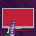 Hand Holding Computer Remote Control infront of Blank Wide Flat Color PC Screen. Creative Background Idea for Product