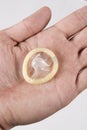 Hand holding condom Royalty Free Stock Photo