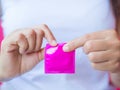 Hand holding condom Royalty Free Stock Photo