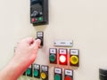 Hand holding the control panel of the industrial plant and pushing or turning the button in electrical selector switch,button Royalty Free Stock Photo