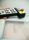 Hand holding the control panel Royalty Free Stock Photo