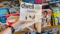 Hand holding a copy of Dwell Magazine