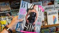 Hand holding a copy of the Harper`s Bazaar magazine with Alicia Keys on cover