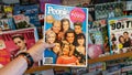 Hand holding a copy of People magazine with Beverly Hills 9010 TV series on cover Royalty Free Stock Photo