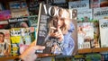 Hand holding a copy of Vogue magazine with Taylor Swift on cover