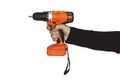 Hand holding cordless drill orange isolated on white background. tightening the screws. screw gun Royalty Free Stock Photo