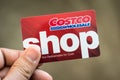 Hand holding a Costco wholesale gift card