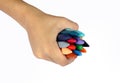 Hand holding crayons Royalty Free Stock Photo