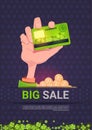 Hand Holding Credit Card Over Big Sale St. Patrick Day Holiday Poster Template Background