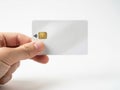 Hand holding a credit card with an rfid chip isolated on white background Royalty Free Stock Photo