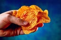 Hand holding a crisp, fresh chip, with vibrant colors and textures that emphasize its crunchy and savory qualities. Generative AI
