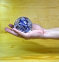 Hand holding crystal ball Royalty Free Stock Photo