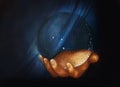 Hand holding crystal ball. Detail from my own reproduction of Leonardo DaVinci painting Saviour of the World.