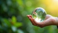 Hand holding crystal earth globe. Earth Day. Environment day, save clean planet, ecology concept. Royalty Free Stock Photo