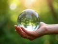 Hand holding crystal earth globe. Earth Day. Environment day, save clean planet, ecology concept. Royalty Free Stock Photo