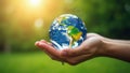 Hand holding crystal earth globe. Earth Day. Environment day, save clean planet, ecology concept. Royalty Free Stock Photo
