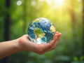Hand holding crystal earth globe. Earth Day. Environment day, save clean planet, ecology concept. Royalty Free Stock Photo