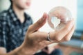 Hand holding crystal world. business symbol Royalty Free Stock Photo