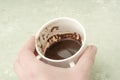 Hand holding a cup of coffee for fortune telling Royalty Free Stock Photo