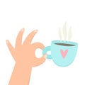 Hand holding cup with hot beverage. Coffee, tea.