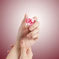 Hand holding 3d red heart shape of diamond Royalty Free Stock Photo