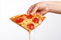 Hand Holding Delicious Melty Pepperoni Pizza Slice Royalty Free Stock Photo