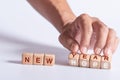 Hand holding Dice with text for illustration of `New Year New Hope` words