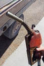 Hand Holding Diesel Fuel Pump Close to Truck Royalty Free Stock Photo